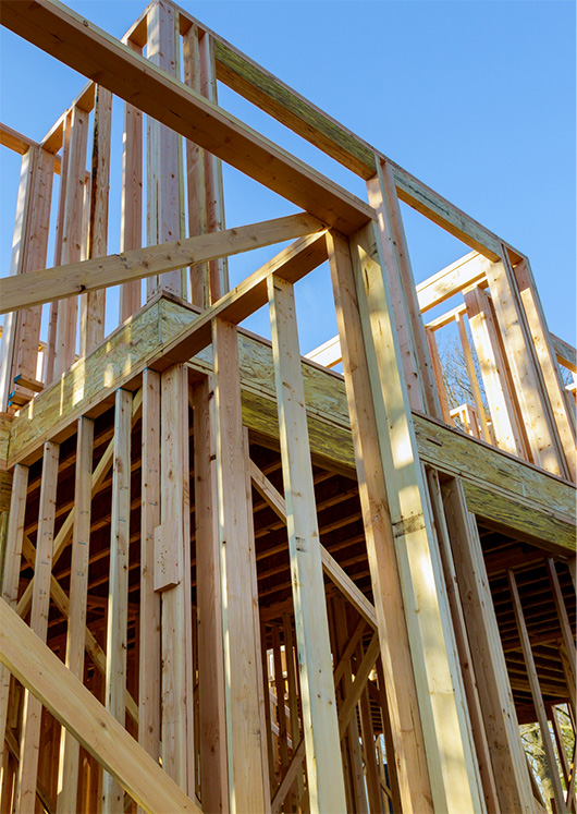 unfinished construction wall of wooden framing of a residential house